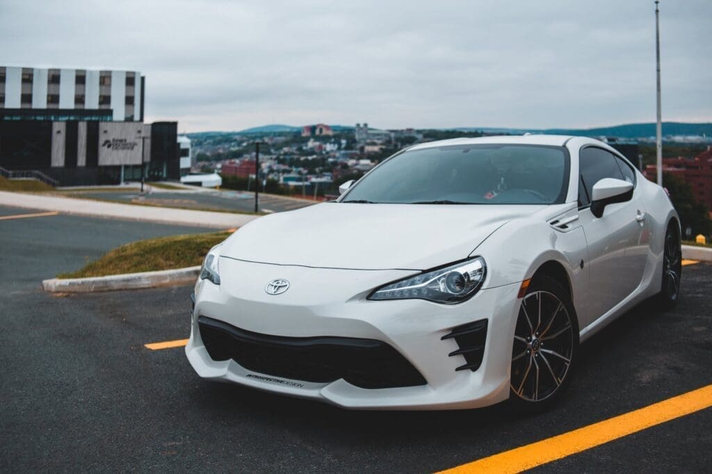 modern white car on street parking