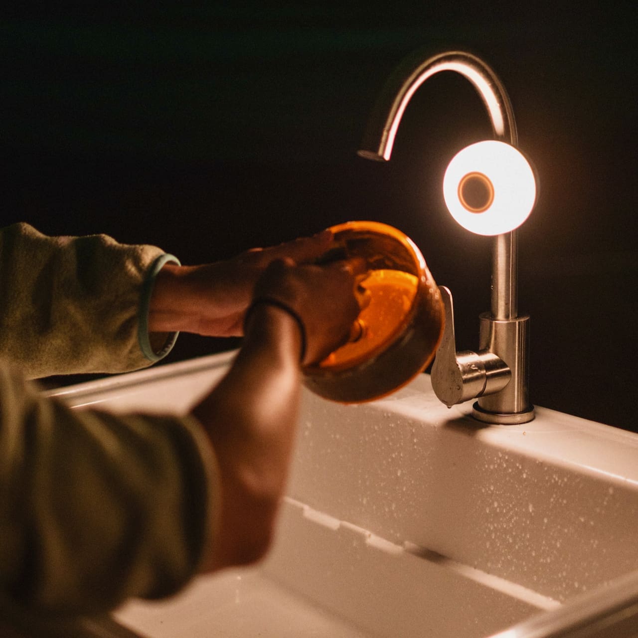 AlpenGlow Mini attached  to a faucet