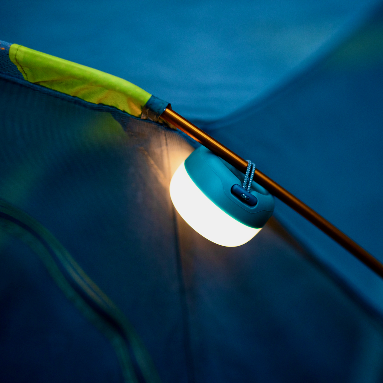 AlpenGlow Mini attached to a tent pole