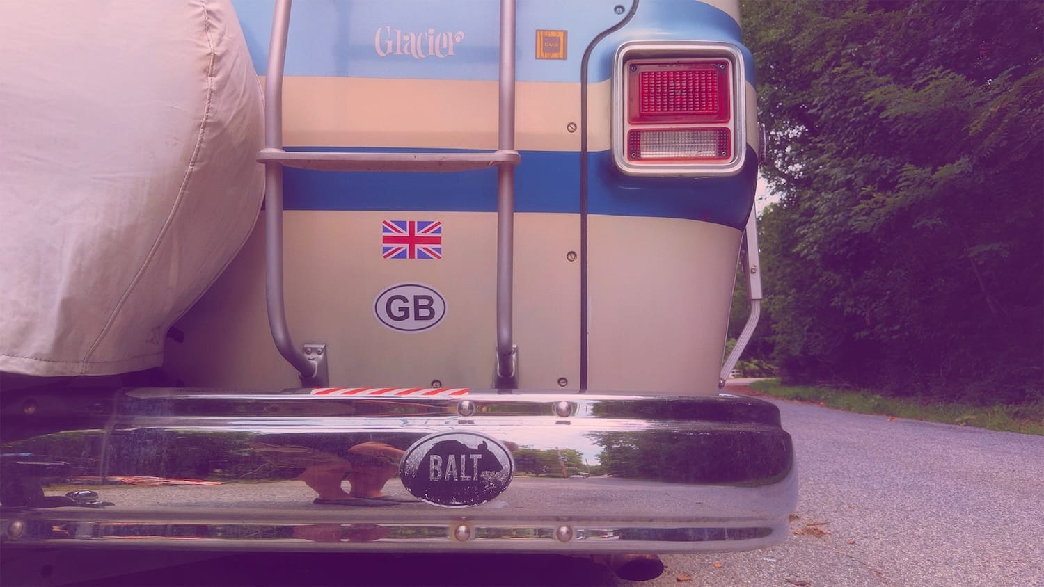 Marco Kathuria 1973 GMC Motorhome photo - Rear end showing bumper, ladder, rear light, and exhaust pipe